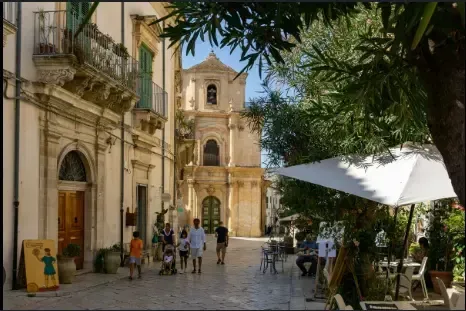 Historic Sicilian street café in a Baroque town featured in Montalbano filming locations