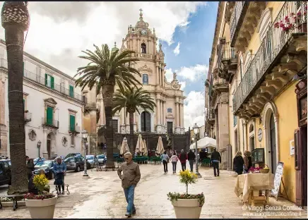 Street scene in Ragusa Ibla with San Giorgio Cathedral in the background