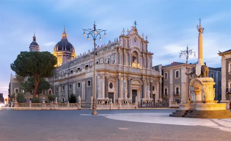 Catania Cathedral and Elephant Fountain at dusk during a full-day Etna and Catania tour