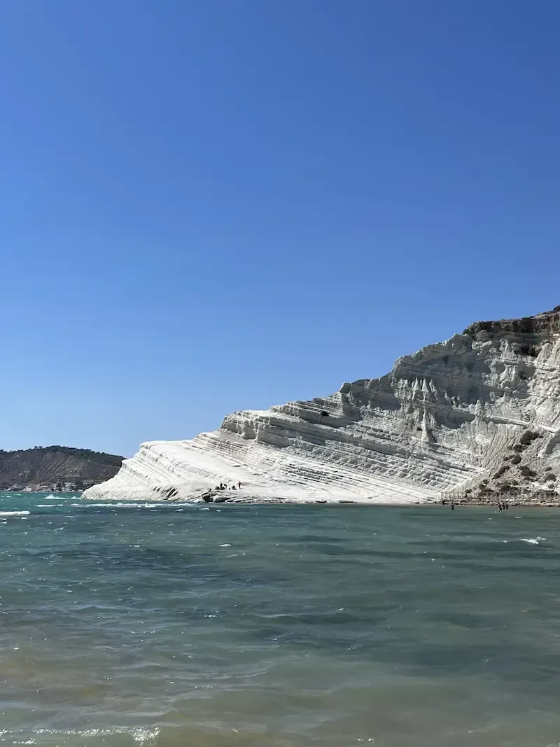 White limestone cliffs of Scala dei Turchi under a clear blue sky