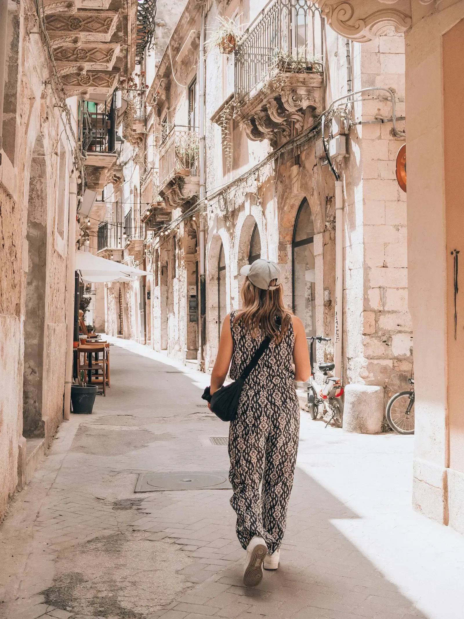 Baroque street in Ortigia, Siracusa with historic façades and warm evening light