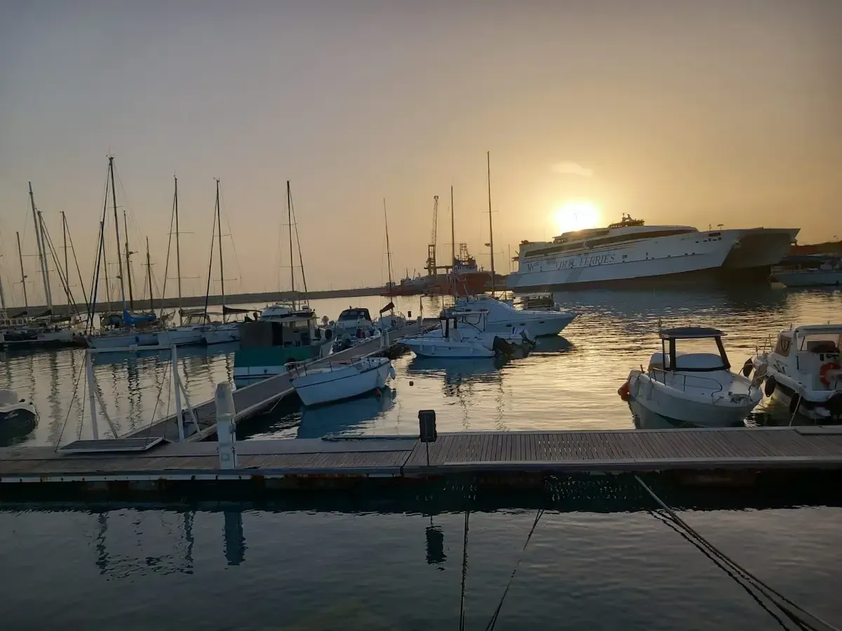Pozzallo Port Transfer with sunset view of the marina and ferry terminal