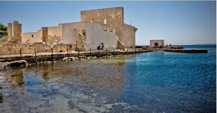 Seaside ruins and clear blue water at the Vendicari Nature Reserve