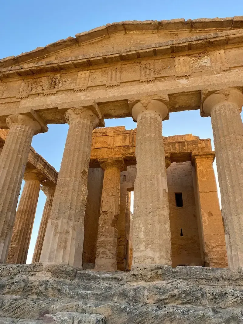 Ancient Greek temple ruins in the Valley of the Temples in Agrigento with Doric columns.