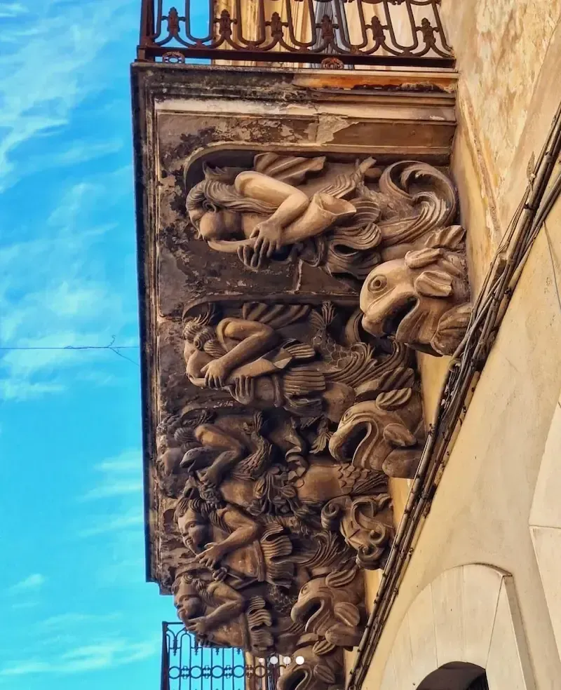 Ornate Baroque architectural detail with sculpted figure in Ragusa Ibla