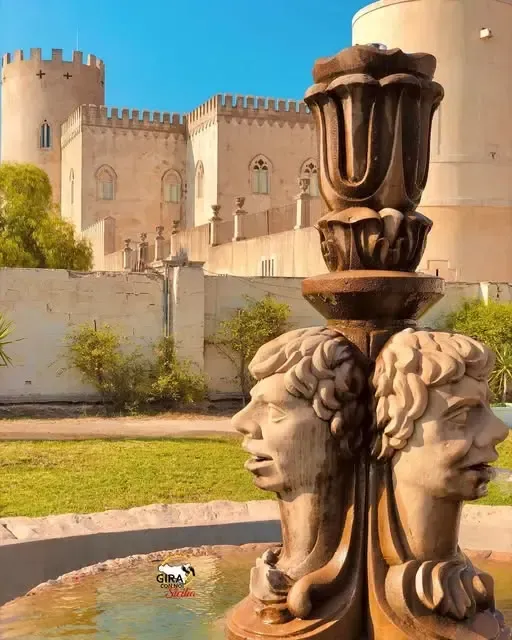 Exterior view of Donnafugata Castle with its stone façade and crenellated towers