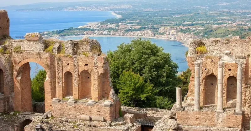 Panoramic view of the ancient Greek Theatre of Taormina overlooking the sea