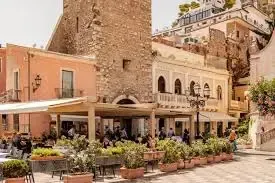 Historic stone archway and square in Taormina, Sicily