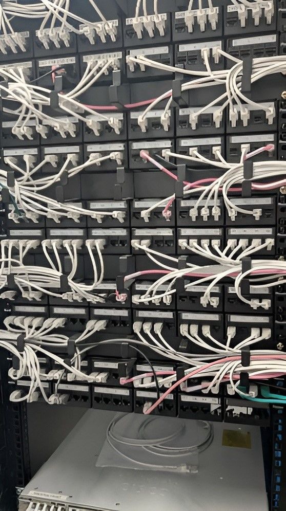 Network Cables Connected to Patch Panels in a Server Rack — Robert Coony Electrician in Nambucca Heads, NSW