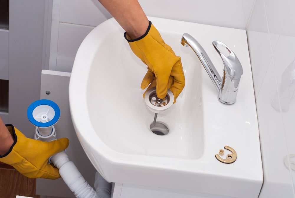 Cleaning Bathroom Sink — Lansdale, PA — Abbey Plumbing & HVAC