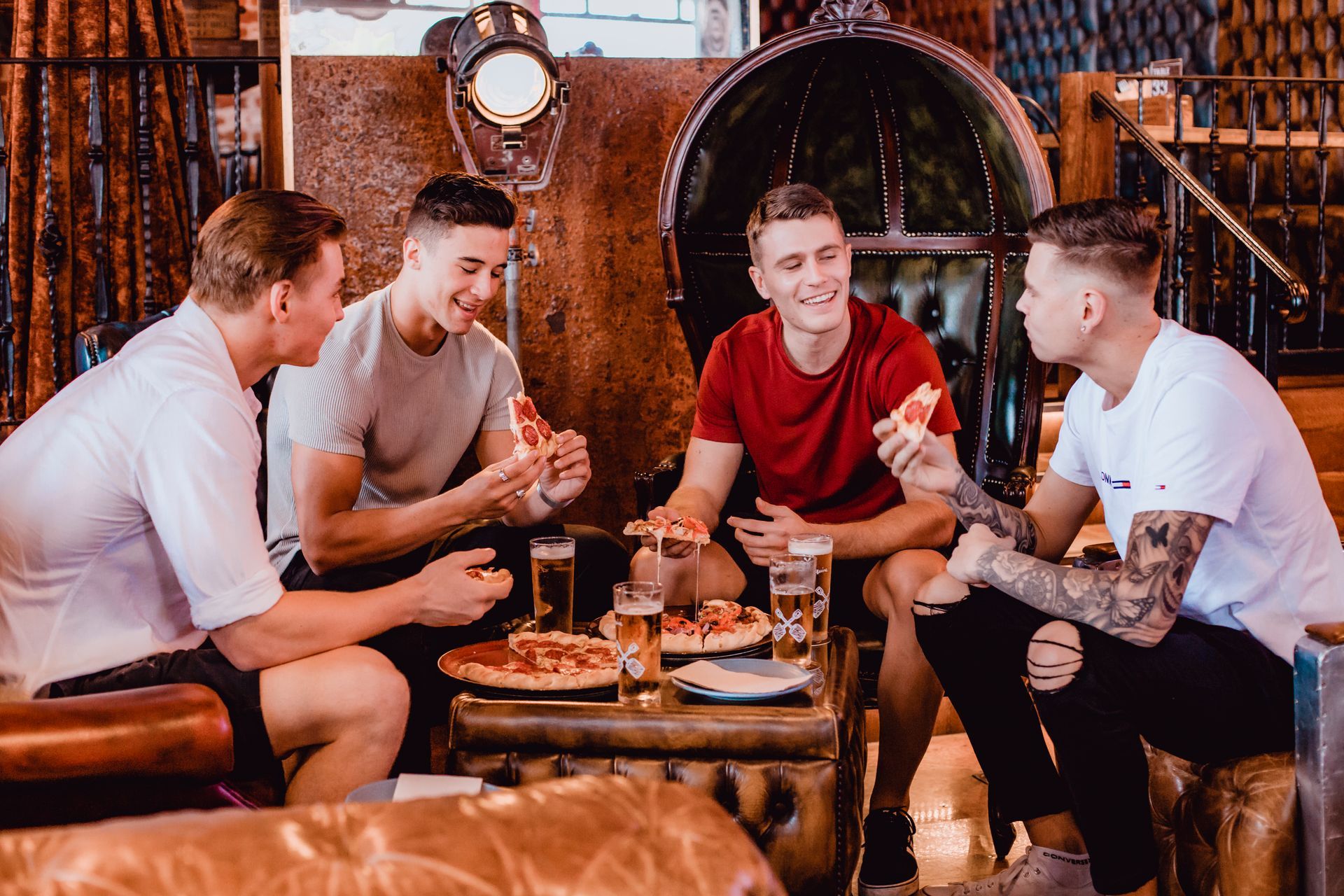Group of Men Eating Pizza — Surfers Paradise, QLD — Steampunk Surfers Paradise
