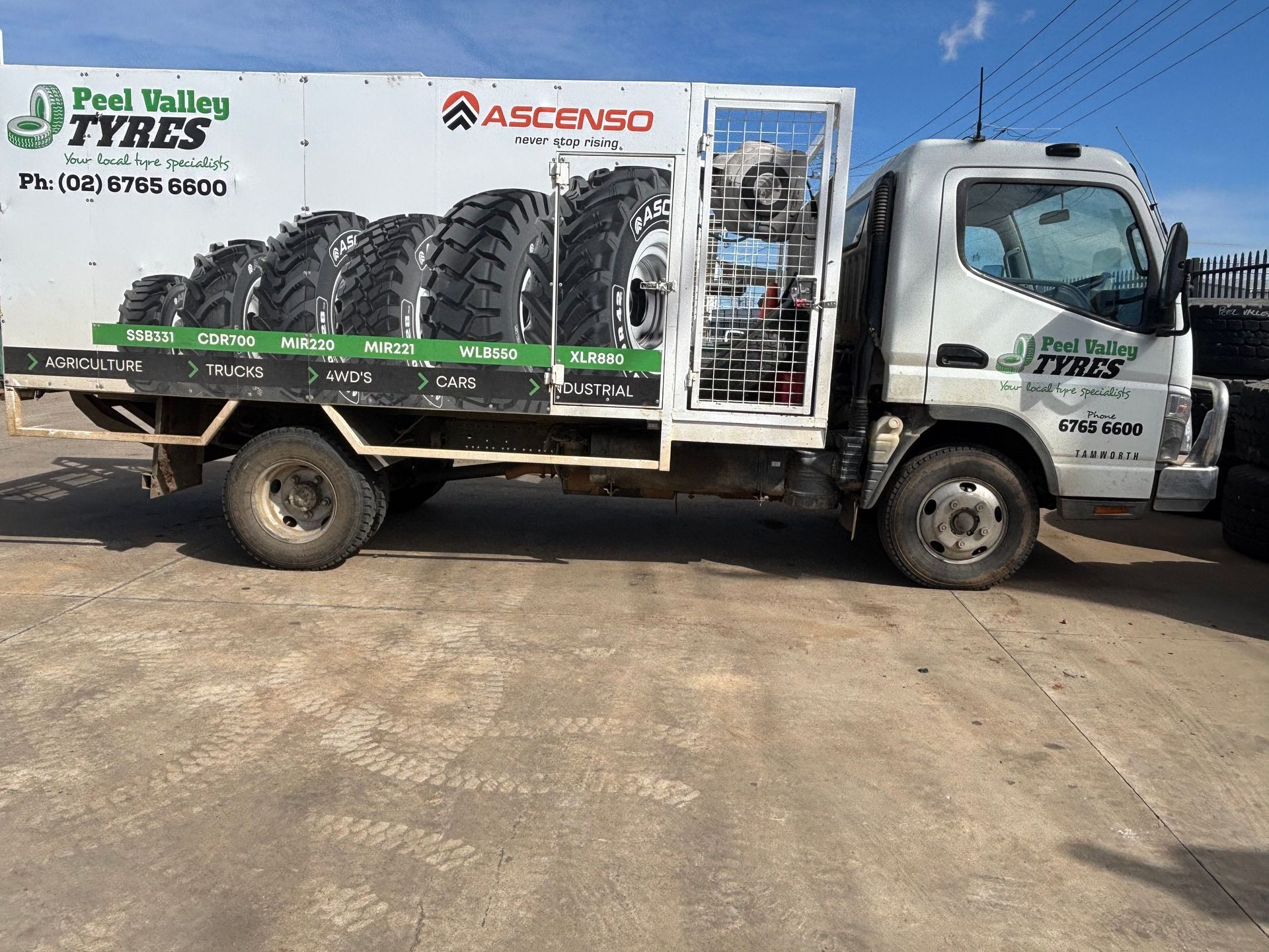 White Peel Valley Tyres truck carrying tires on a concrete surface. — Peel Valley Tyres in Taminda, NSW