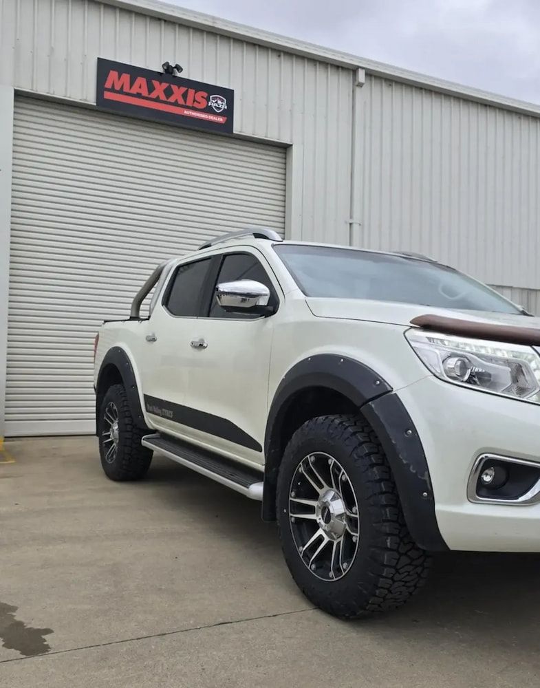 A White Truck is Parked in Front of a Building — Peel Valley Tyres in Taminda, NSW