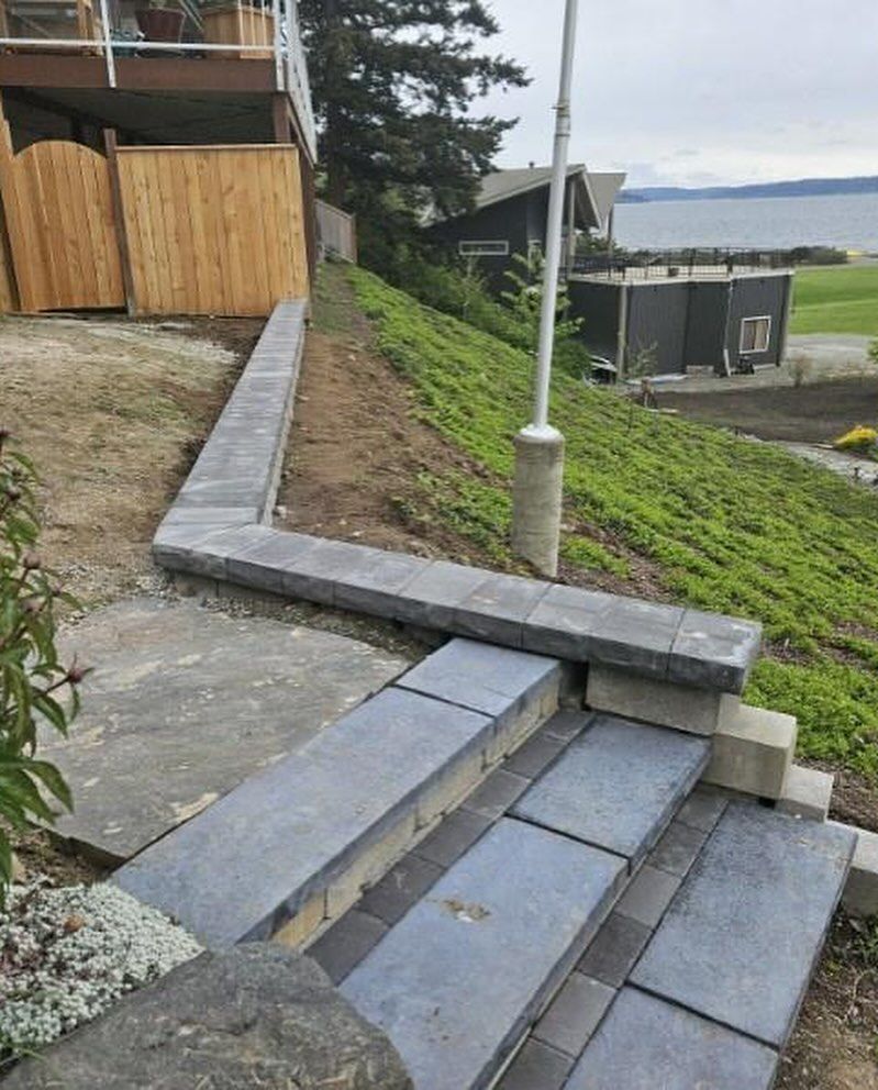 A set of stairs leading up to a house on a hill.