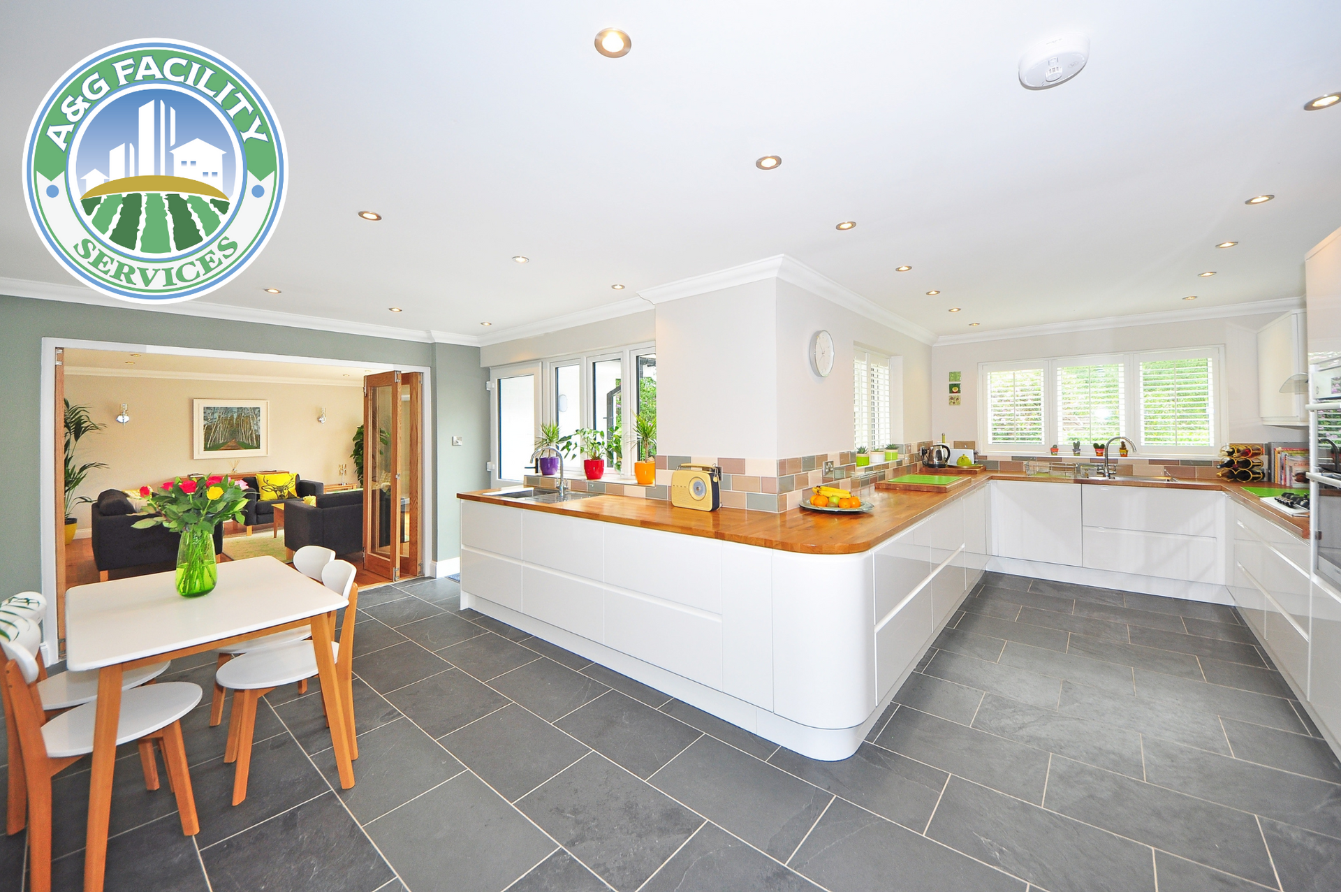 A logo for a & g facility is on a tile floor