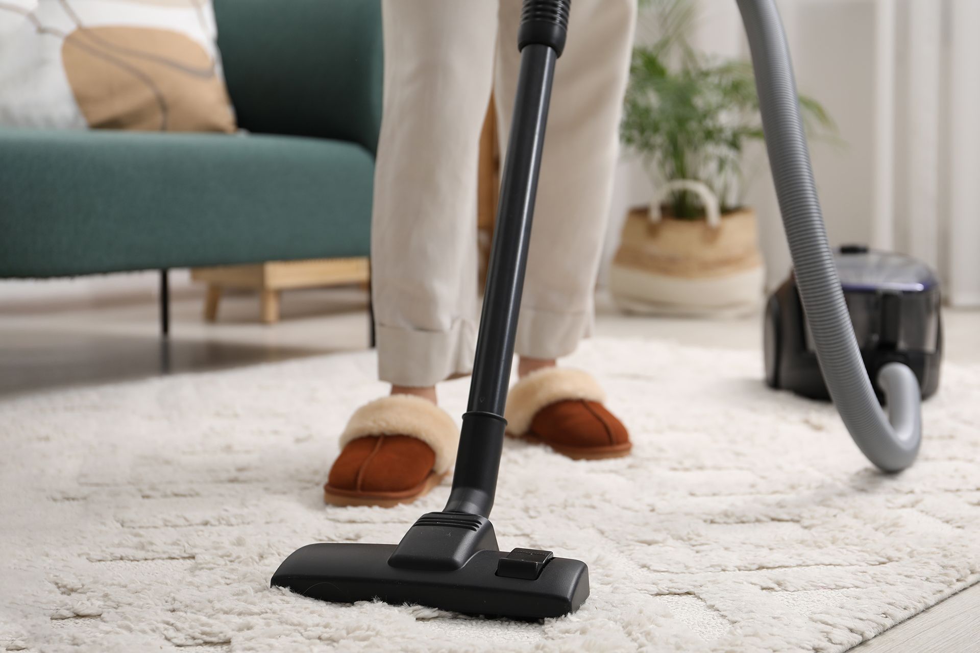 A blue and white van is parked in front of a building.
