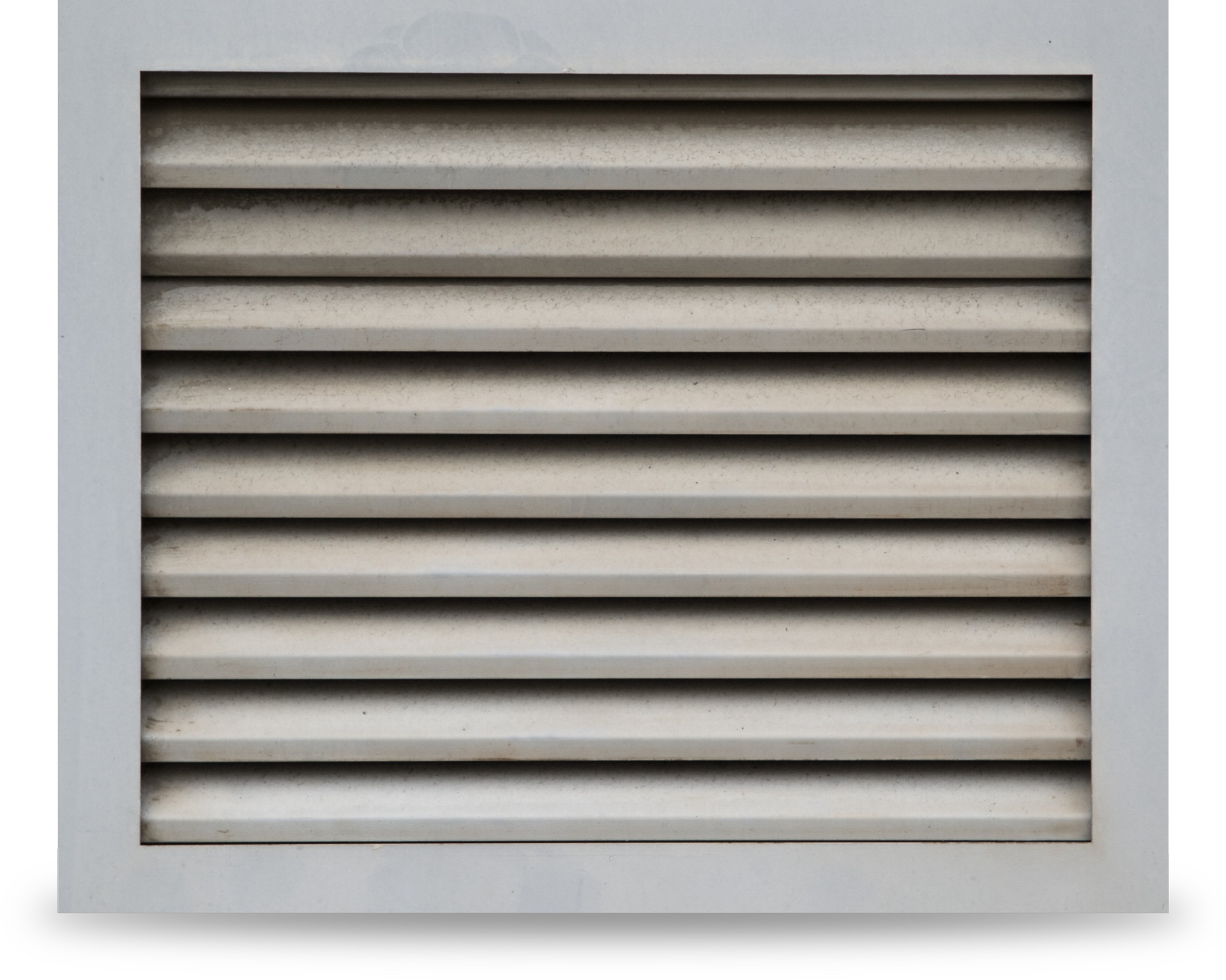 A close up of a metal ventilation grille on a white background. A close up of a metal ventilation grille on a white background.