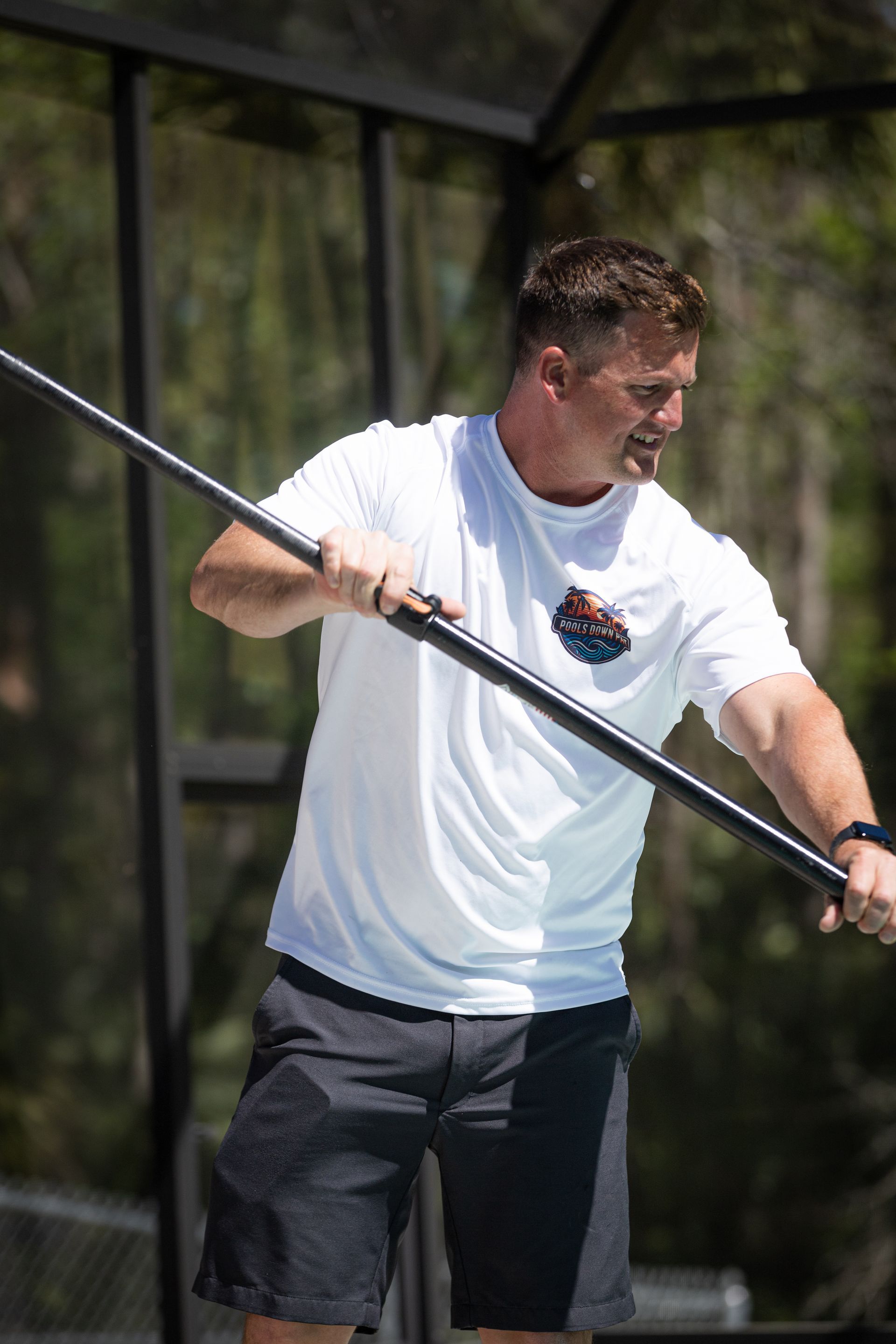 A before and after picture of a swimming pool that has been painted blue.