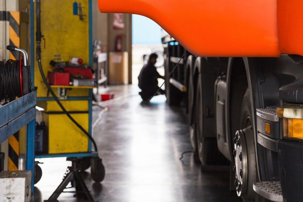 An auto electrician working on a truck in the Illawarra