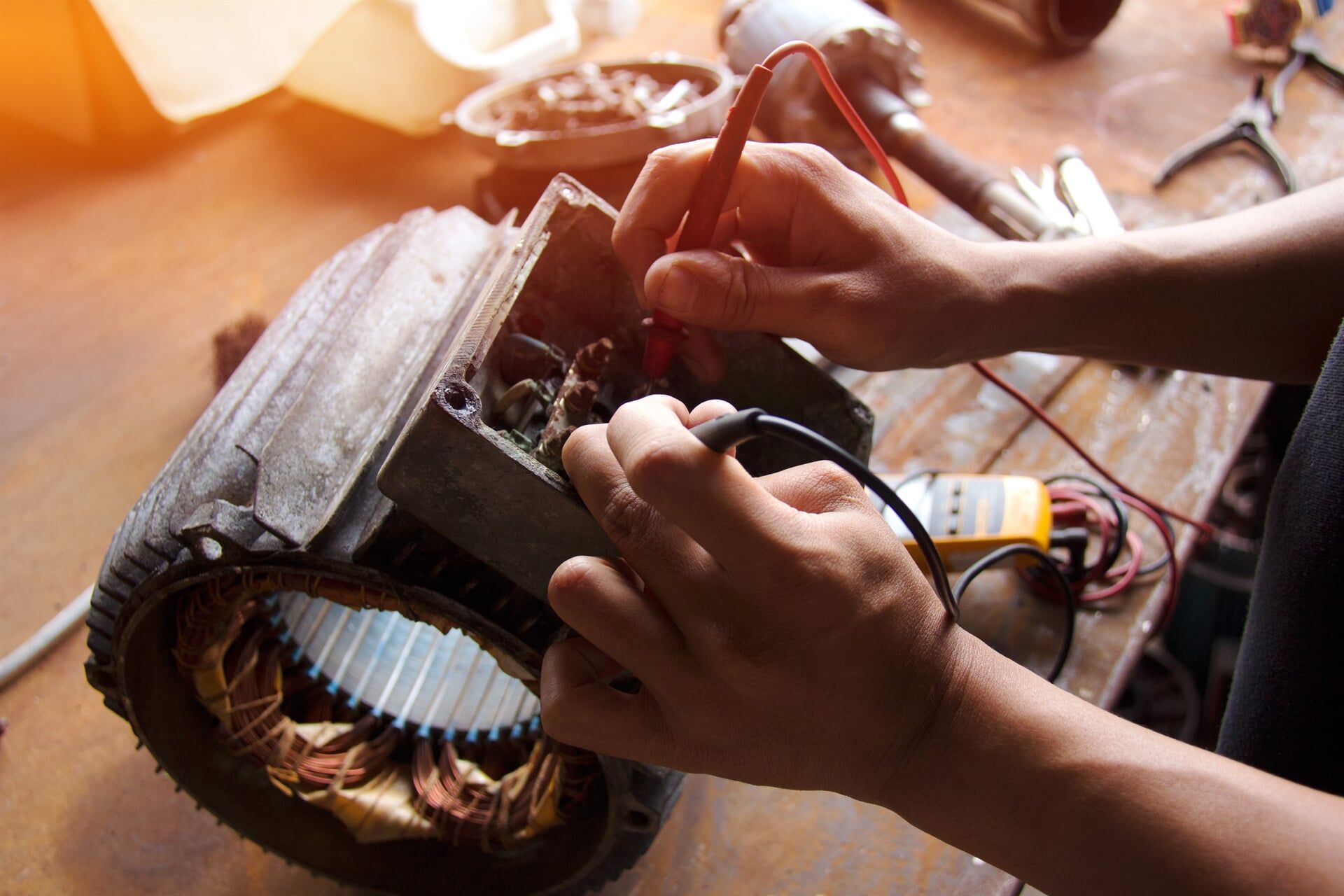 man fixing a machinery