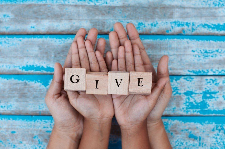 Two Pairs of Hands | Give Back