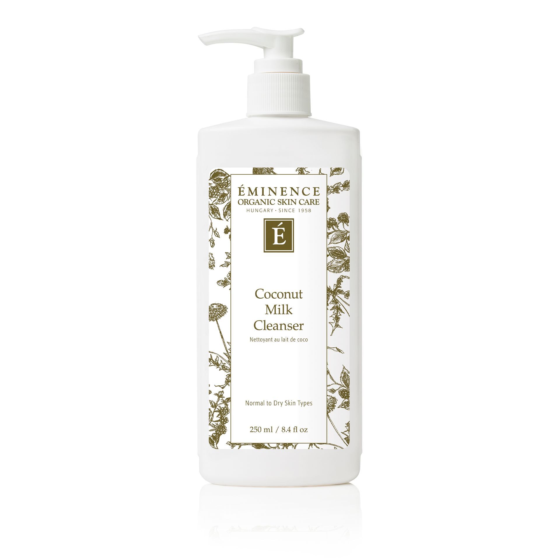 White bottle of Eminence Coconut Milk Cleanser, pump dispenser, botanical design, for normal to dry skin.