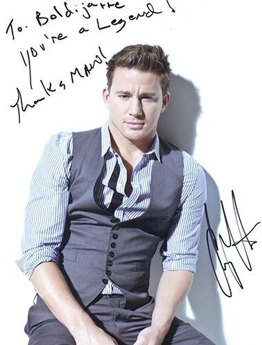 Channing Tatum, wearing a vest and shirt, posing, with a handwritten note that says 