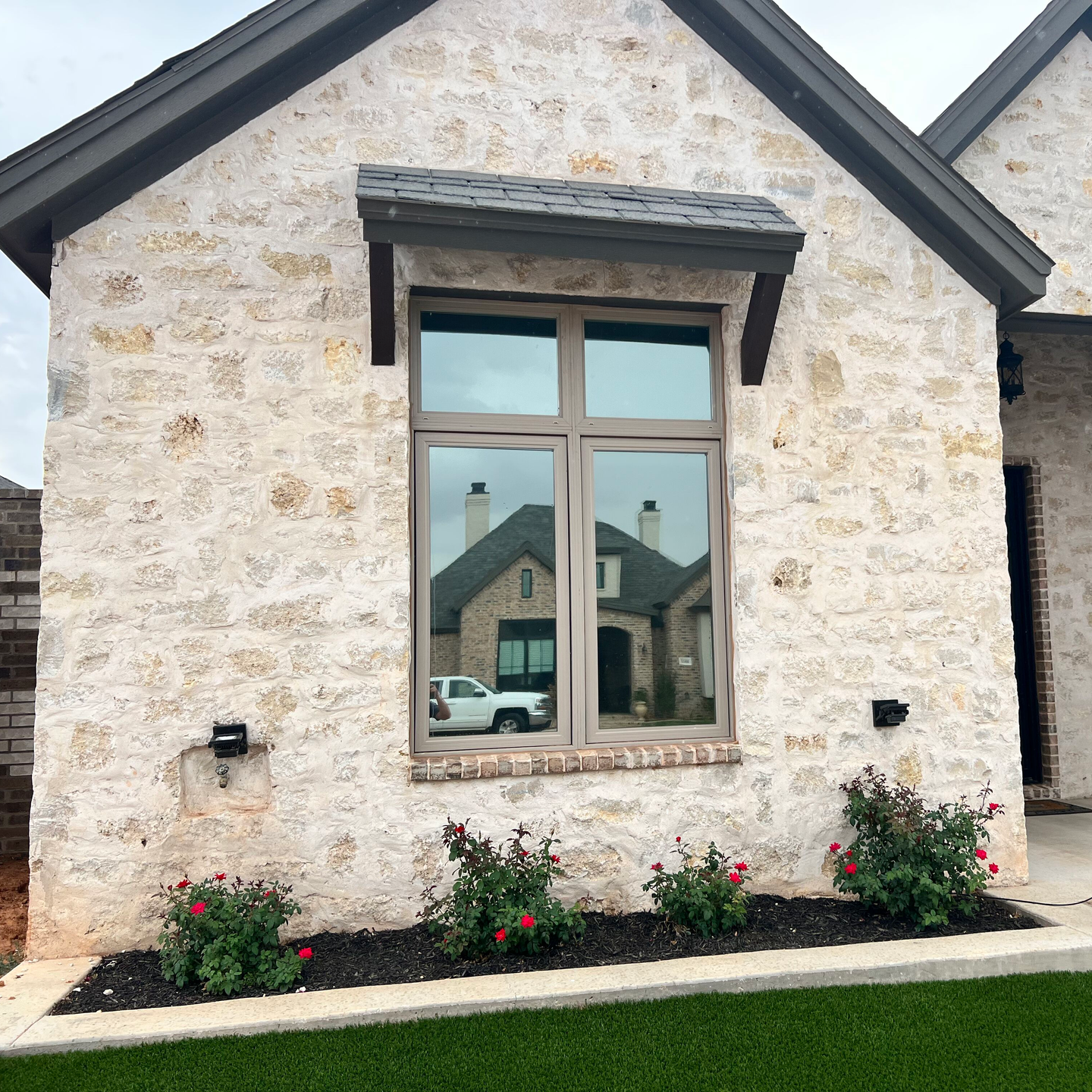 A house with a large window on the front of it