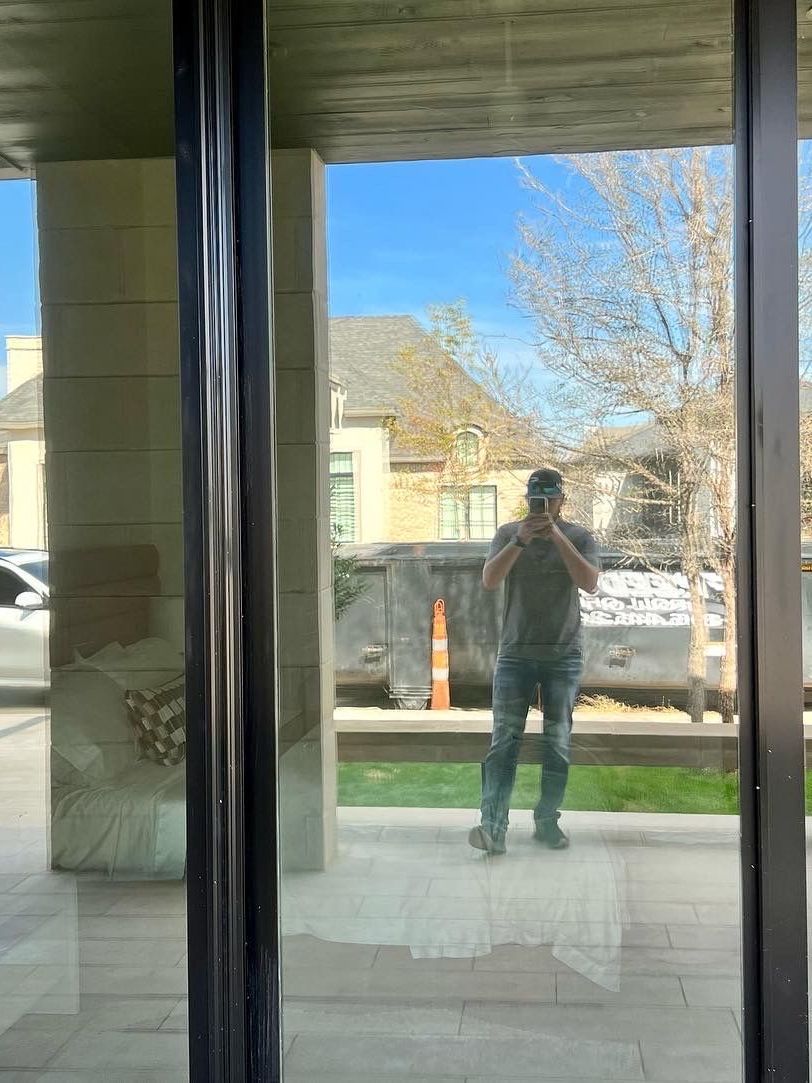 A man is taking a picture of himself in a mirror.