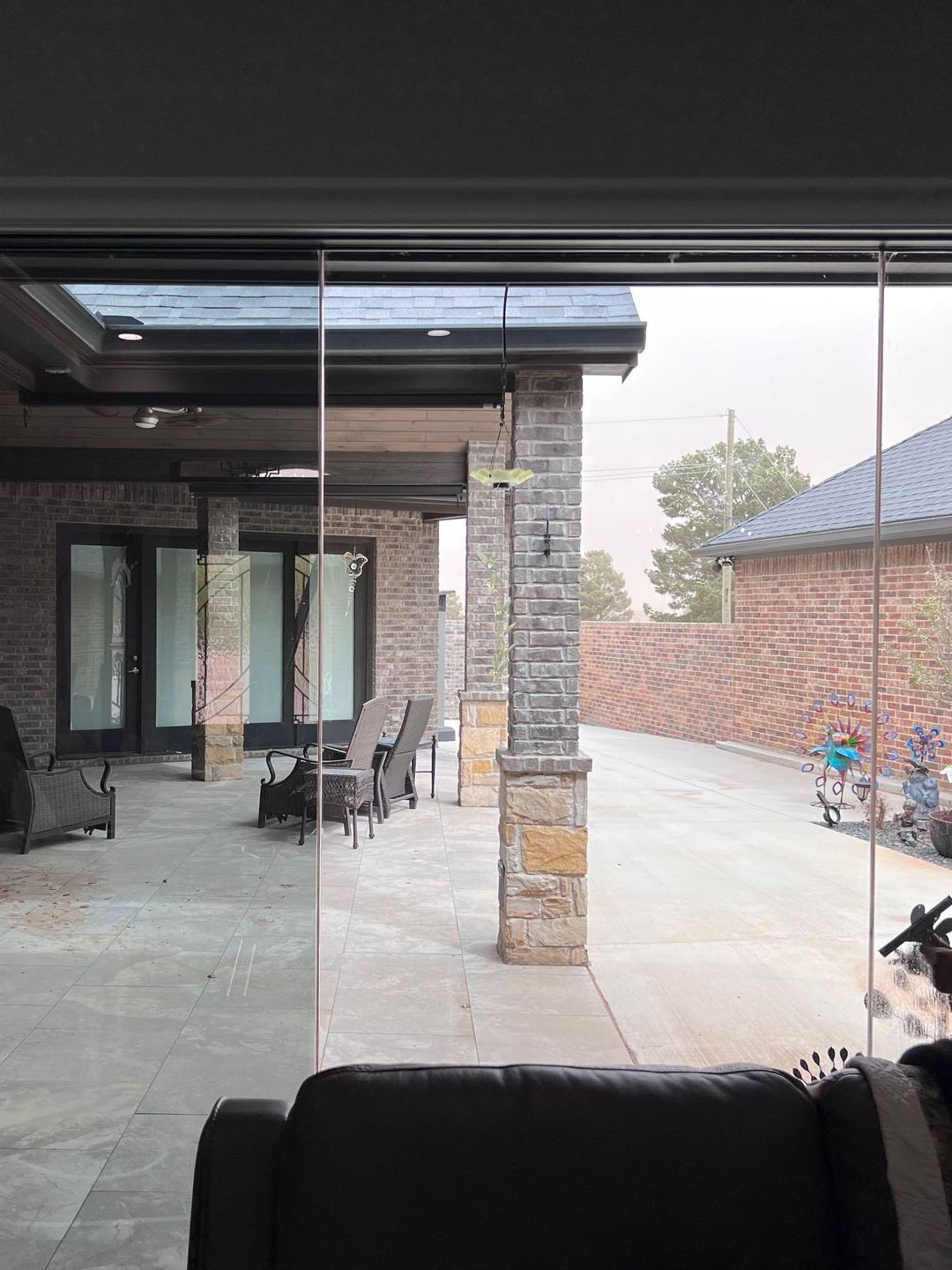 A living room with a sliding glass door leading to a patio.