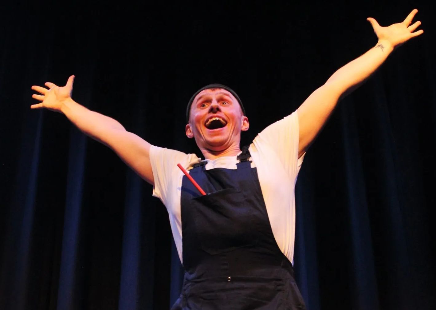 Photo of Ben Glover performing in a clowning theatre show.