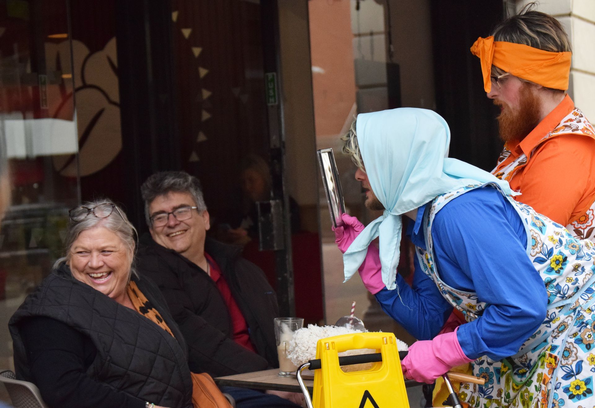 Dustbuster, Martha, inspects a family, with a magnifying glass for dust