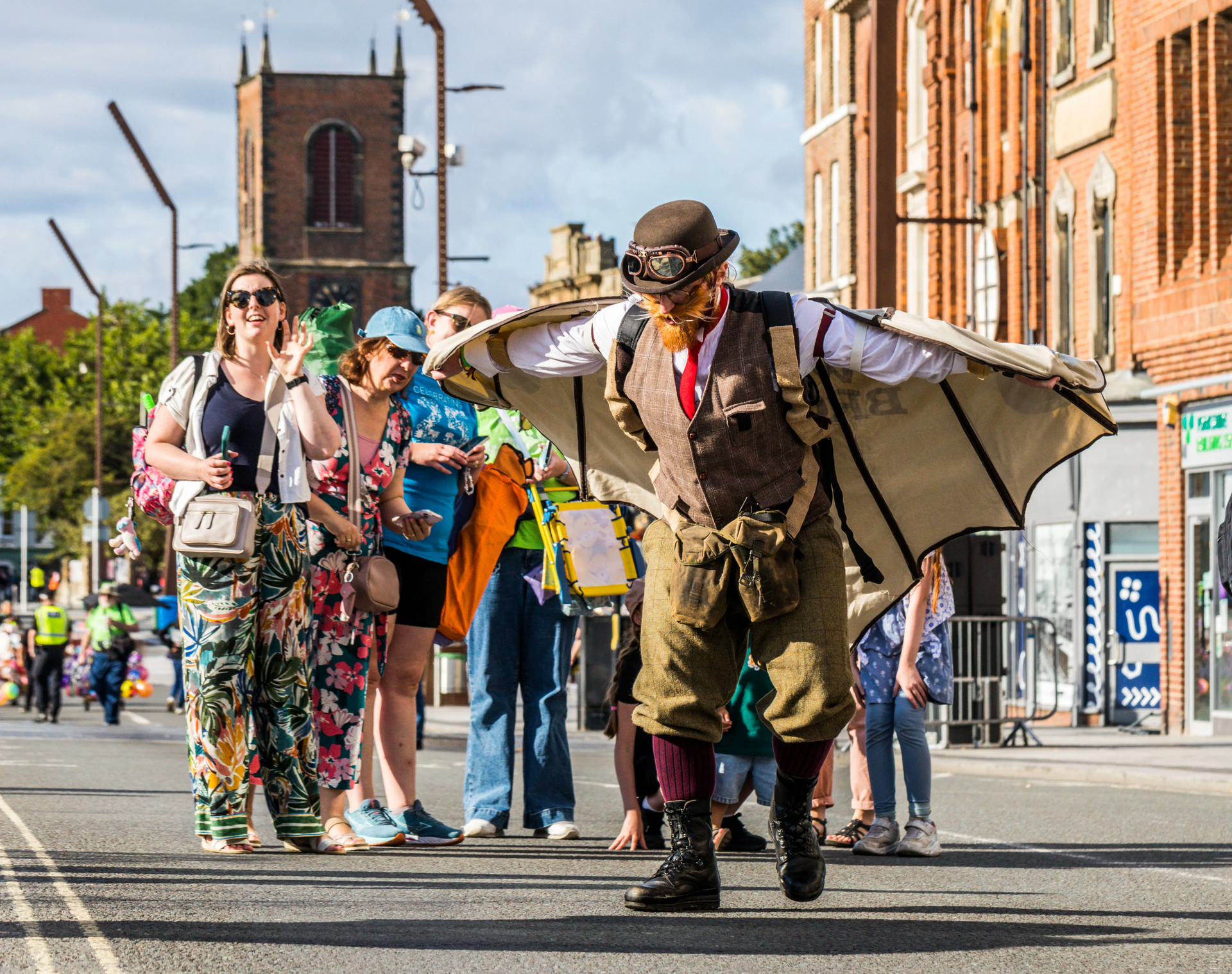 Feasible Ferret Theatre’s walkabout act The Wrong Brothers entertaining people at a street event.
