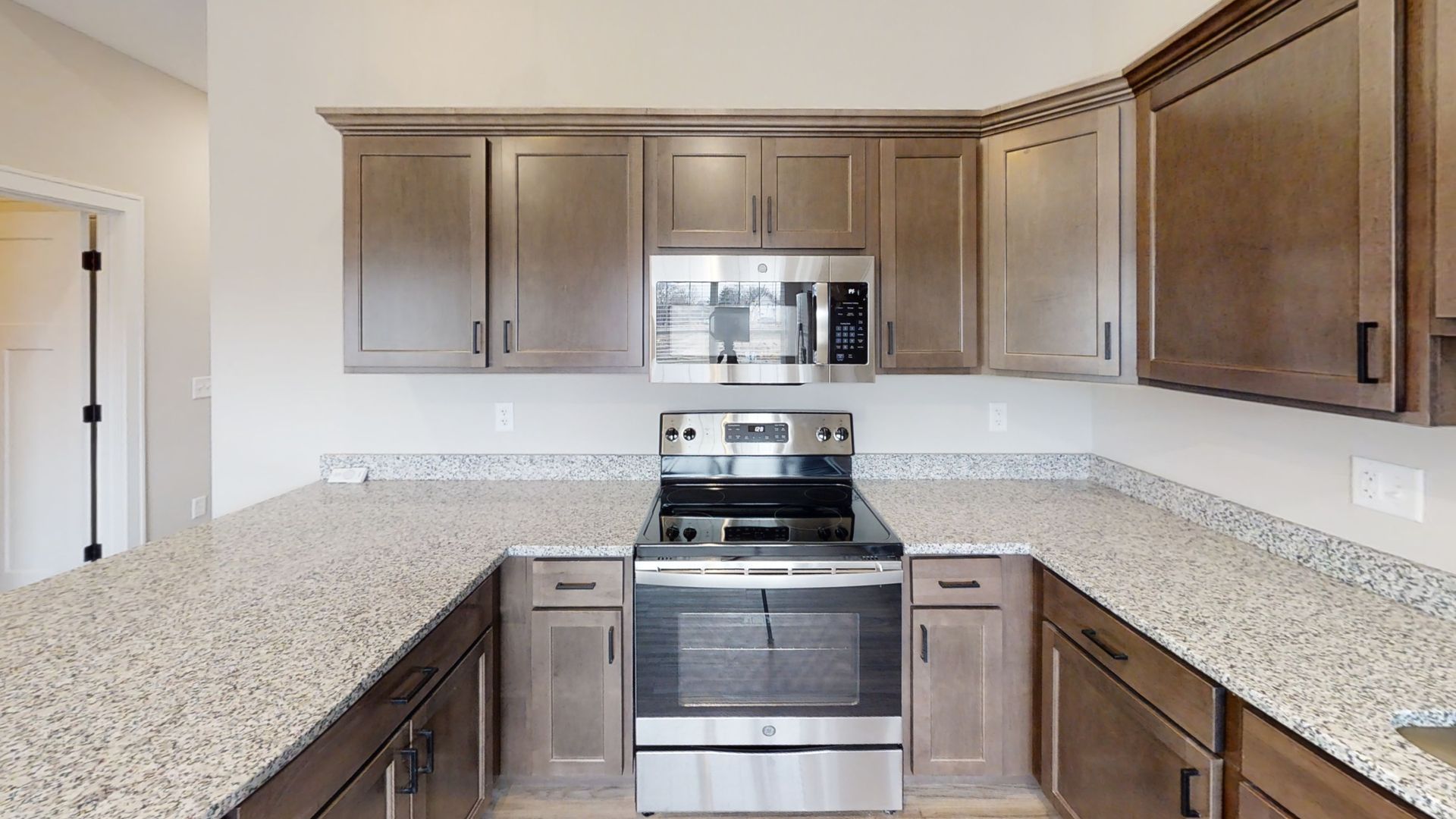 A kitchen with stainless steel appliances and granite counter tops