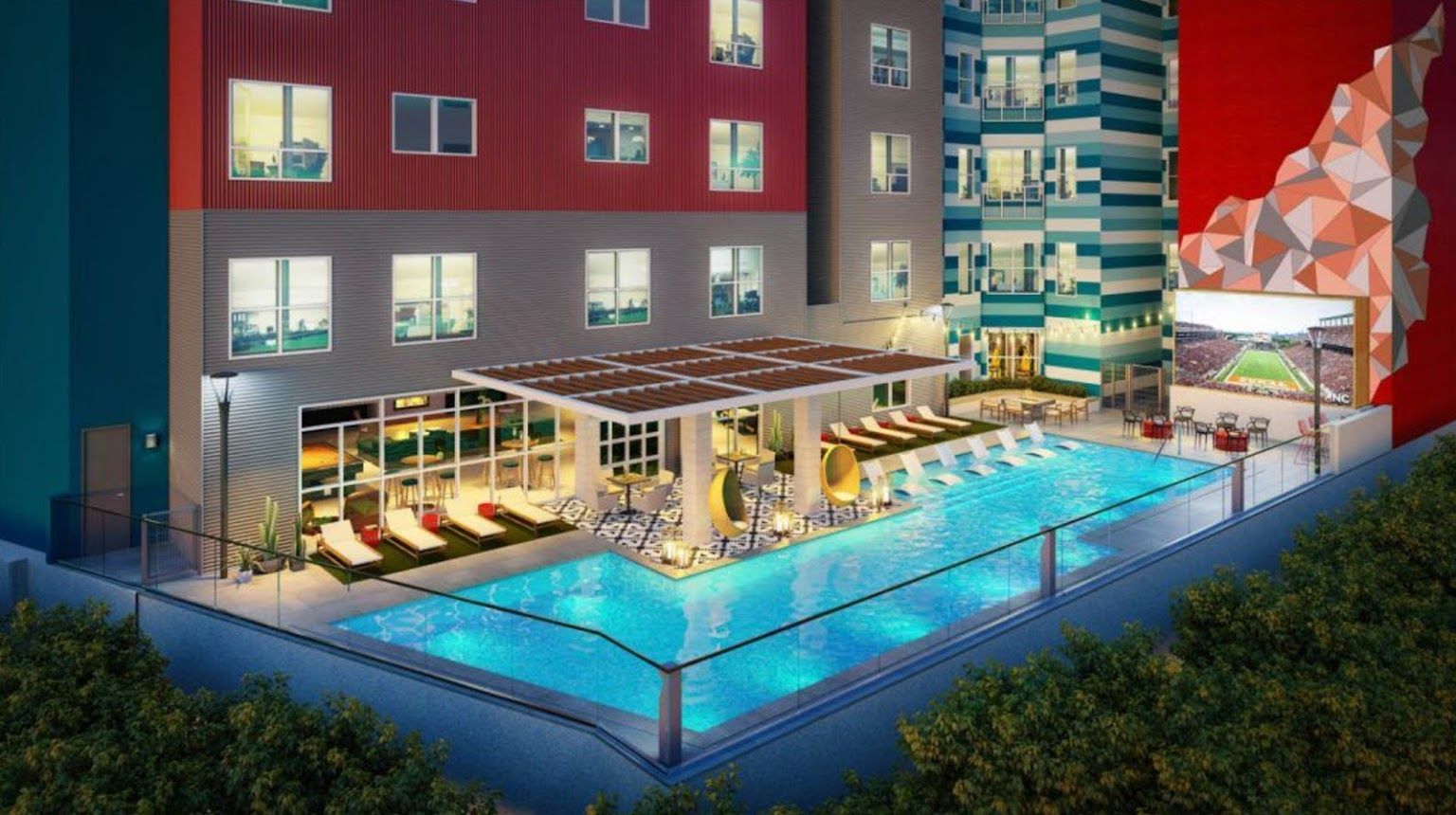 Exterior photo of an apartment building and pool