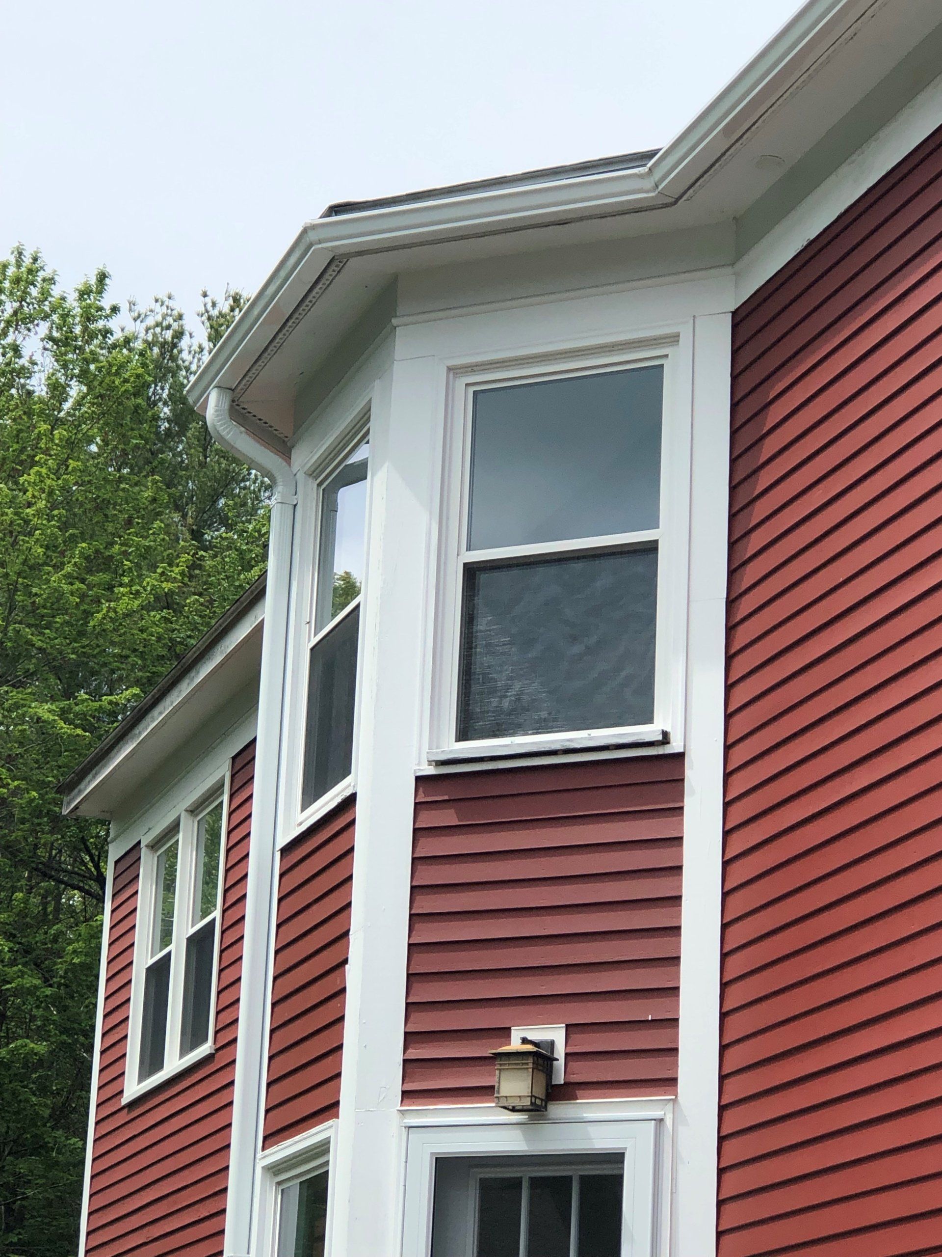 A Worker Installing a New Window – Jaffrey, NH – Rainflow, Inc.