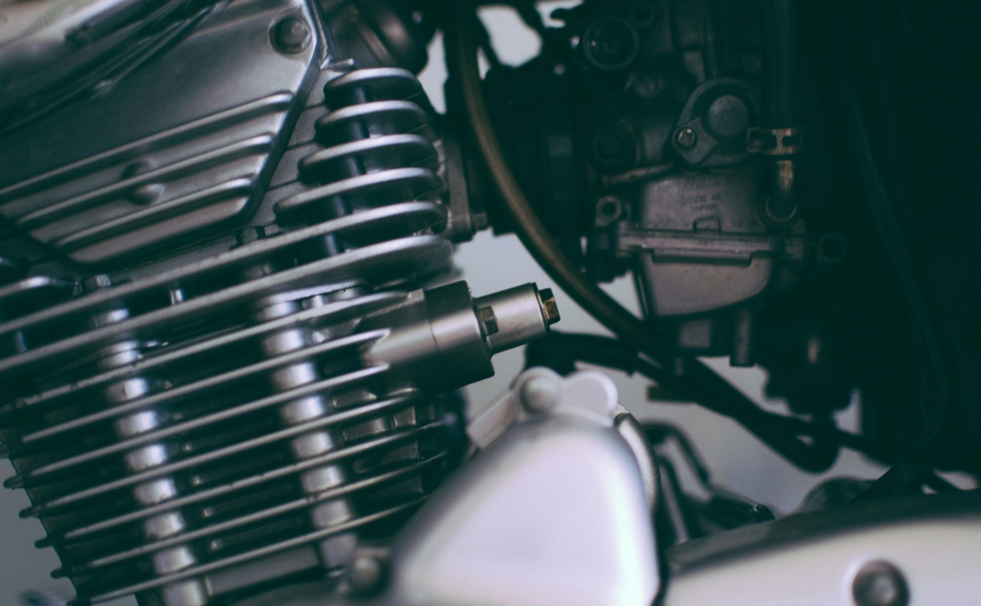 A close up of the engine of a motorcycle.