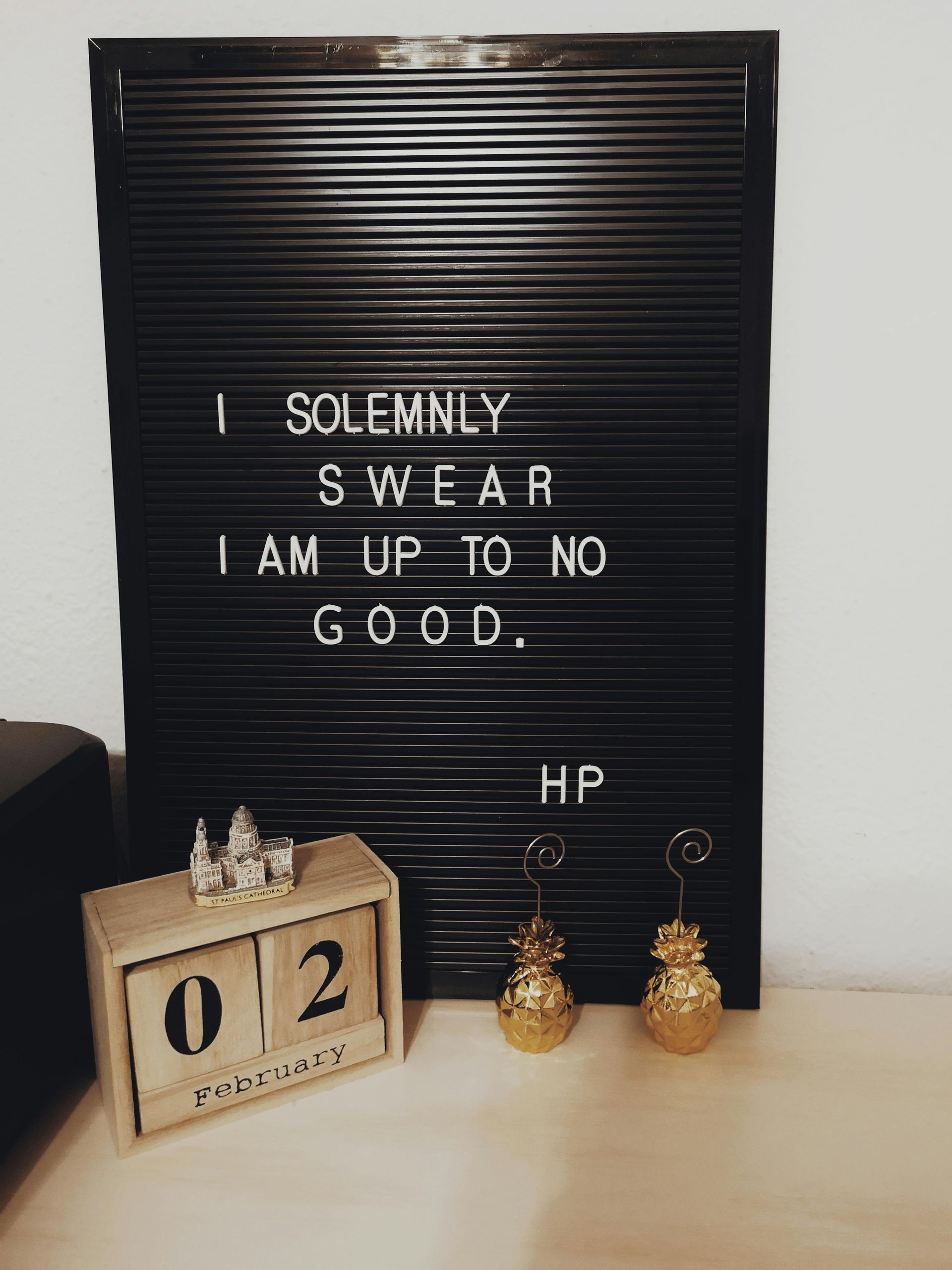 A letter board with a quote on it that says `` i solemnly swear i am up to no good . ''