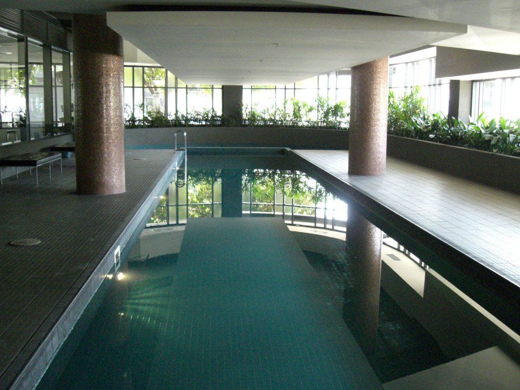 A large indoor swimming pool in a building