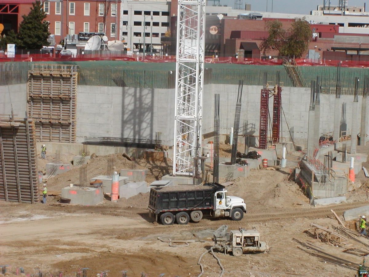 A dump truck is driving through a construction site