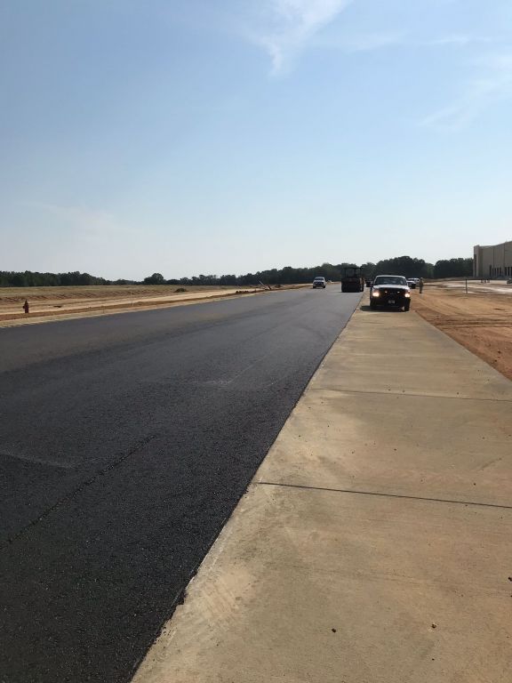 A truck is parked on the side of a road