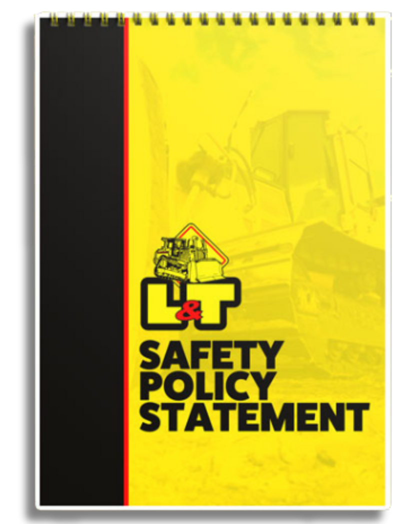 A yellow notebook with the words safety policy statement on it