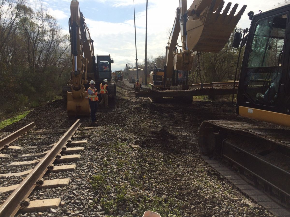 Construction workers are working on a train track