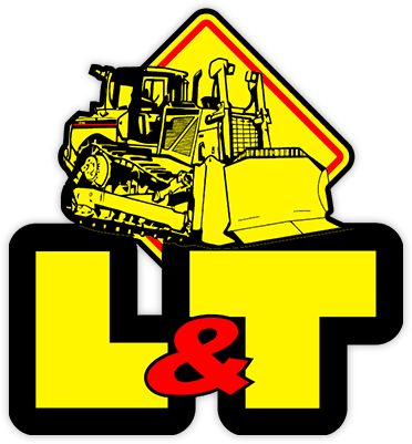 A bulldozer is sitting on top of a yellow sign that says l & t.