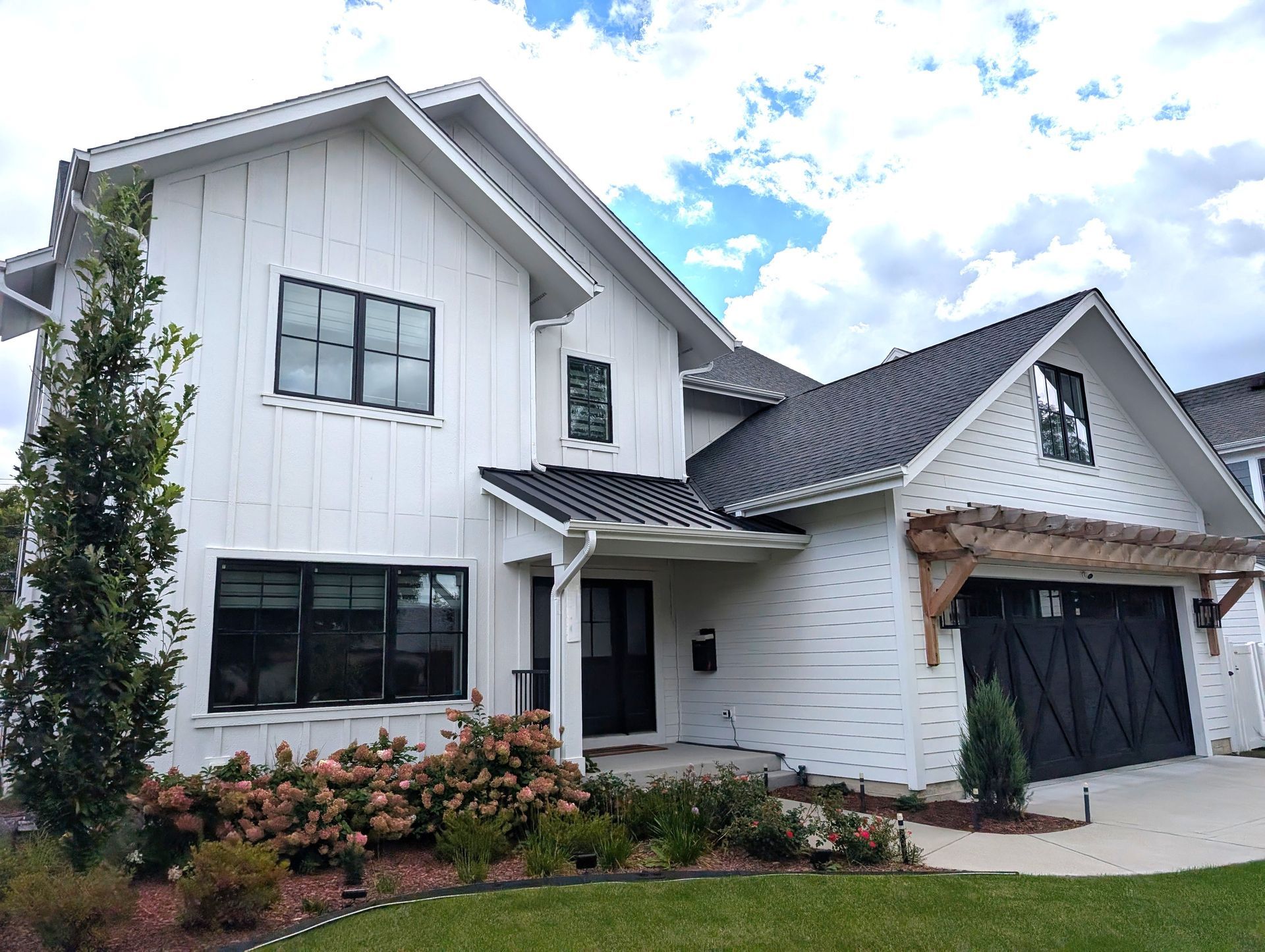 Custom home in Elmhurst Illinois exterior with pergola and Hardie siding. Chicago western suburbs in Elmhurst, Glen Ellyn.