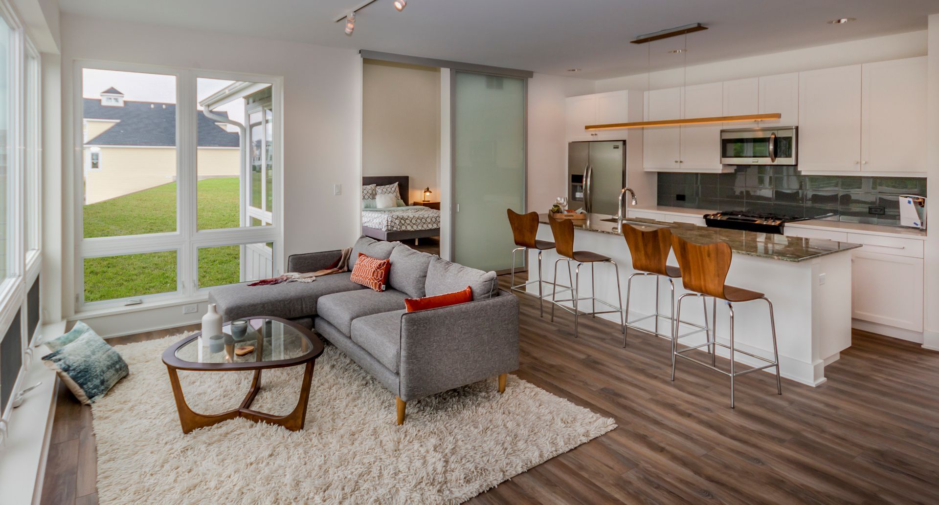 Open concept living room and kitchen in custom home design. Townhomes Naperville, Hinsdale, Glen Ellyn, Highland Park.  