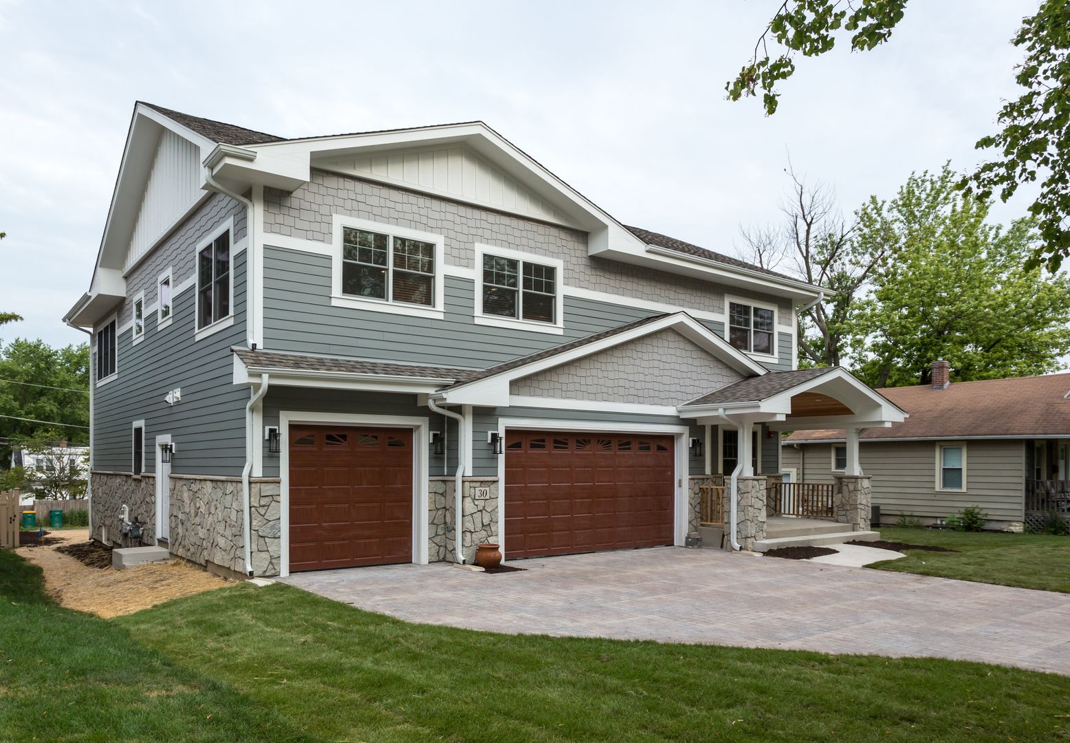 Custom home in Westmont, Illinois exterior front porch and garage.  Chicago western suburbs Hinsdale, Elmhurst, Naperville.
