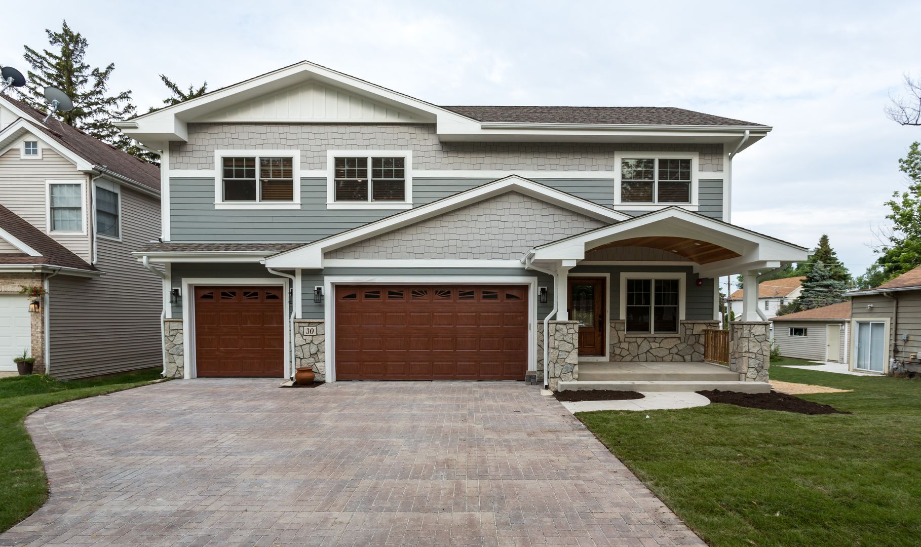 Custom Home in Westmont, Illinois with stone and a portico. Chicago western suburbs in Hinsdale, Elmhurst, Highland Park.