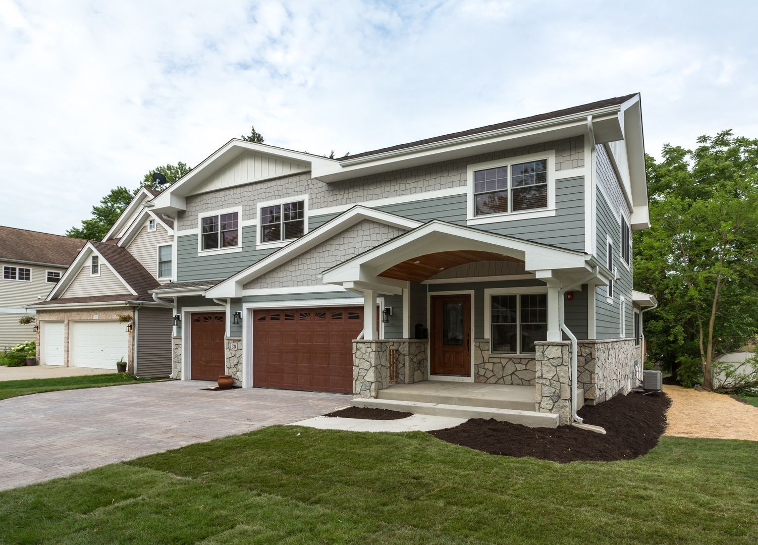 Custom Home in Westmont, Illinois front porch exterior portico. Chicago western suburbs in Hinsdale, Elmhurst, Naperville.