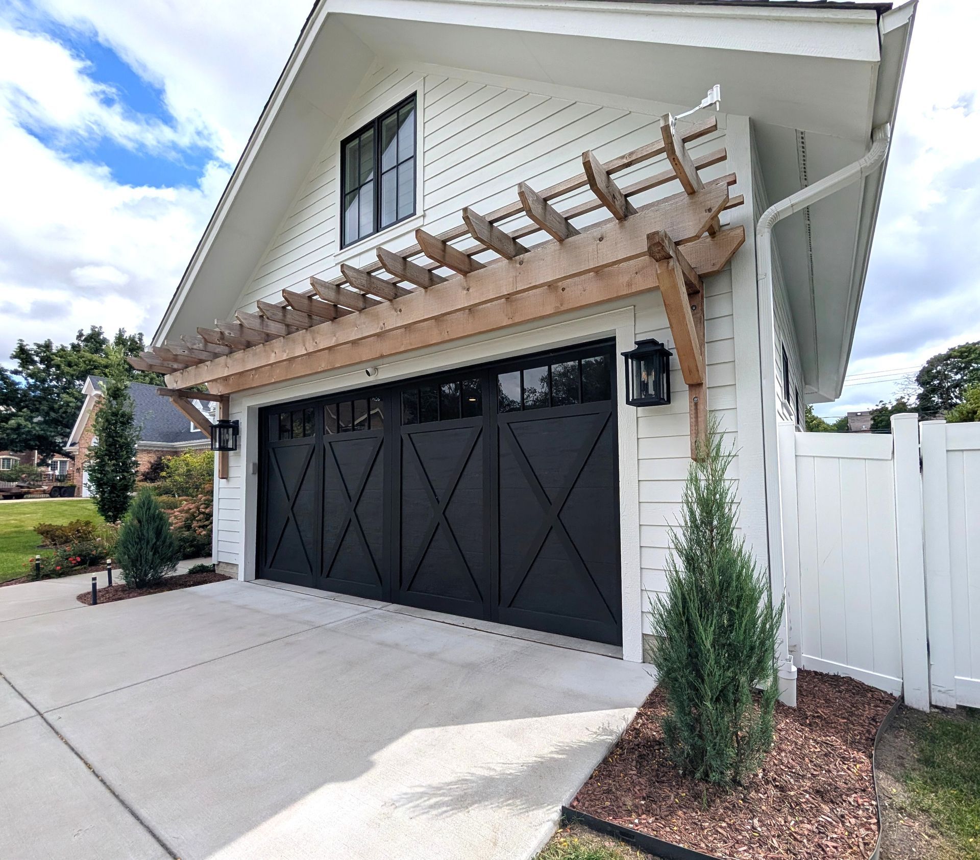 Custom home in Elmhurst Illinois exterior with pergola and Hardie siding. Chicago western suburbs in Hinsdale, Naperville.